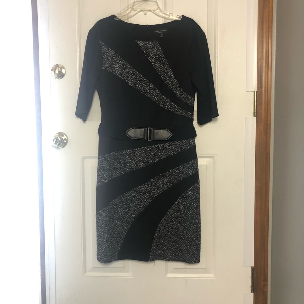 Black Dress with bucle accents. Very Flattering